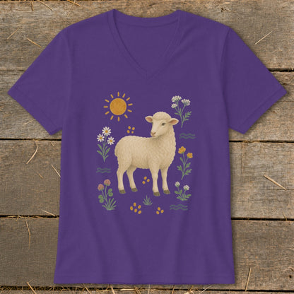 Purple t-shirt with a cream sheep and colorful floral graphic.