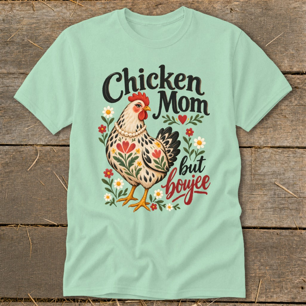 Chicken Mom but boujee text with decorated hen and flowers on a light green t-shirt.