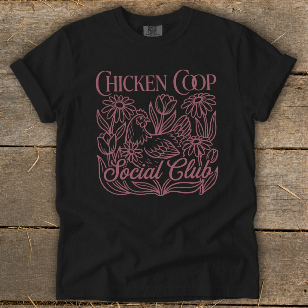 Black t-shirt with pink "Chicken Coop Social Club" text and chicken graphic.