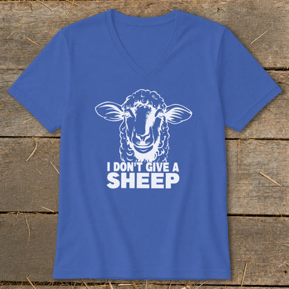 Royal blue v-neck t-shirt with a white sheep graphic and the text "I DON'T GIVE A SHEEP".