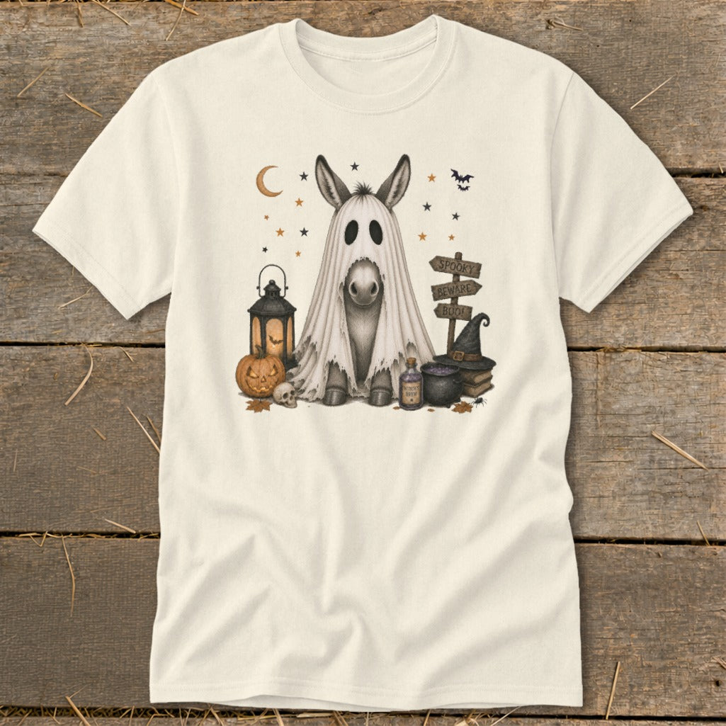 Donkey in ghost costume with Halloween decorations including pumpkin and sign.