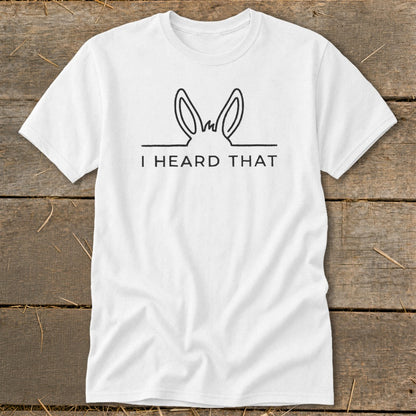 White t-shirt with a line drawing of donkey ears and the text "I HEARD THAT".