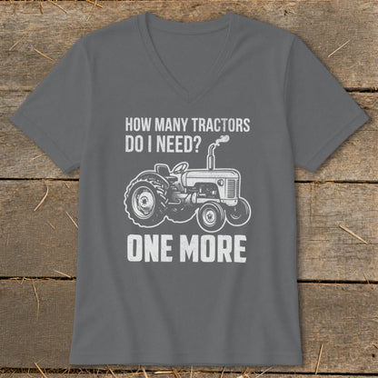 Gray t-shirt with white text and tractor graphic saying "HOW MANY TRACTORS DO I NEED? ONE MORE".