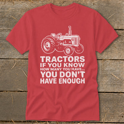 Red t-shirt with a white tractor graphic and text about tractors.