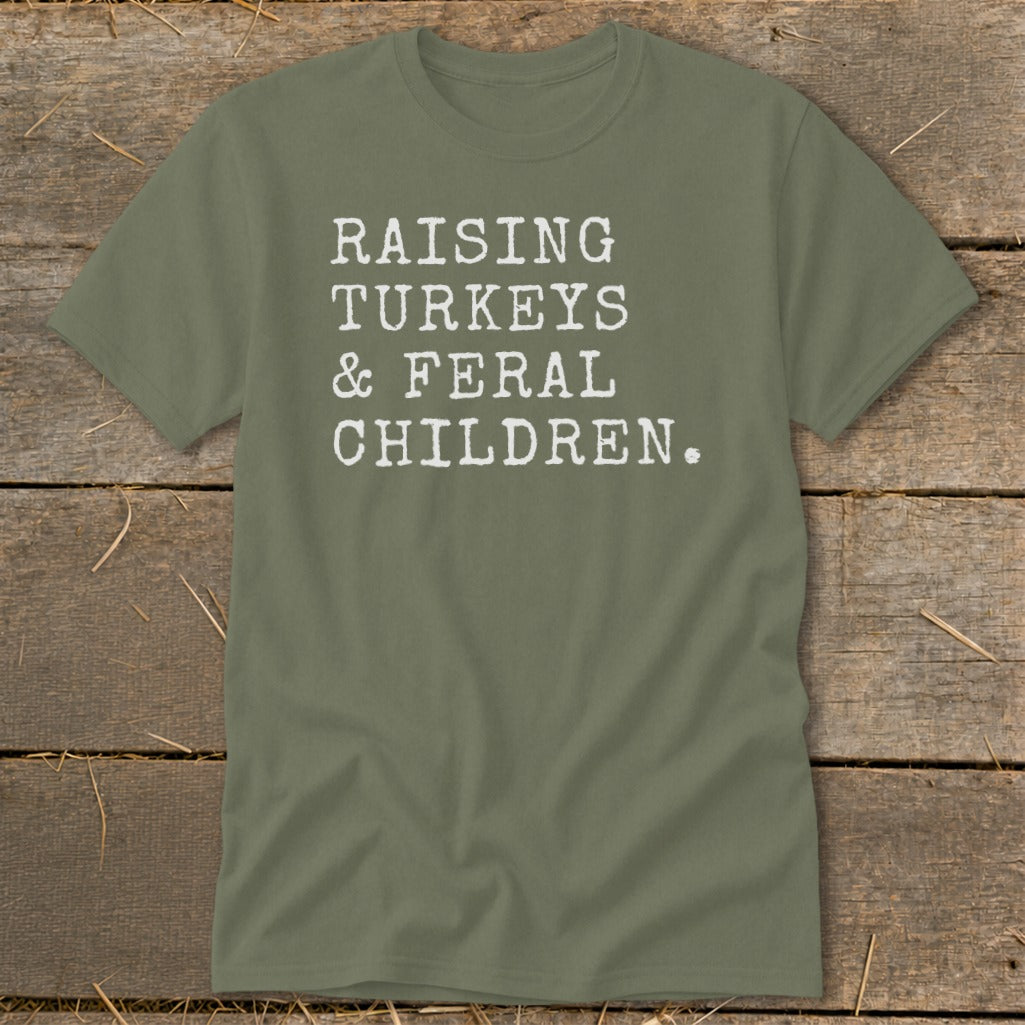 Olive t-shirt with white text reading "Raising Turkeys & Feral Children."