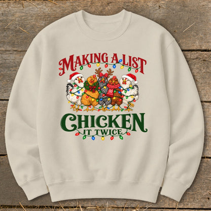 Crewneck sweatshirt with "Making a List, Chicken It Twice" text and festive chickens wearing Santa hats.
