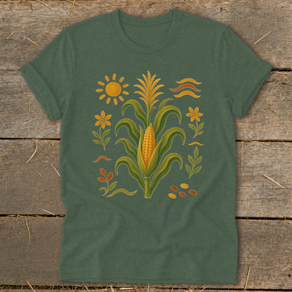Green t-shirt with a central corn stalk illustration and surrounding botanical elements.
