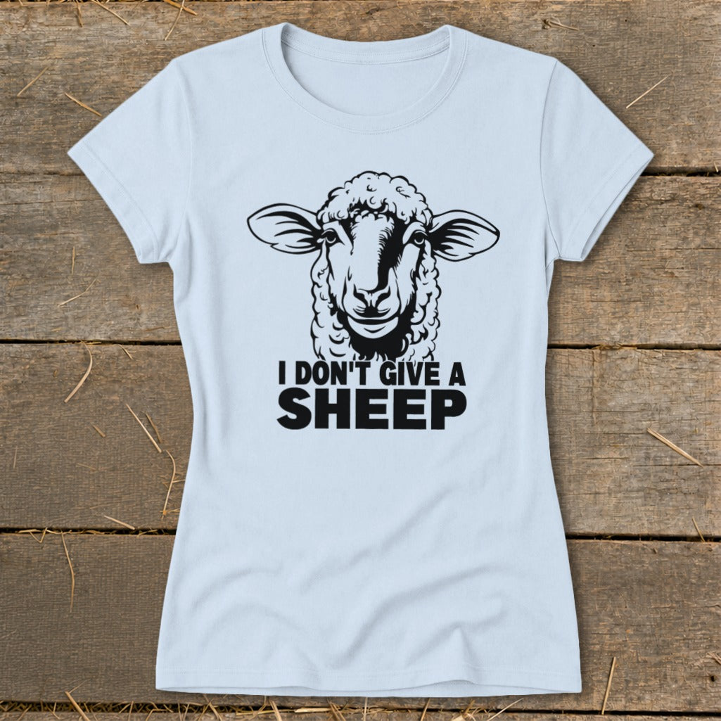 Light blue t-shirt with a black graphic of a sheep and the text "I DON'T GIVE A SHEEP".