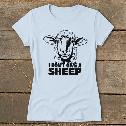 Light blue t-shirt with a black graphic of a sheep and the text "I DON'T GIVE A SHEEP".