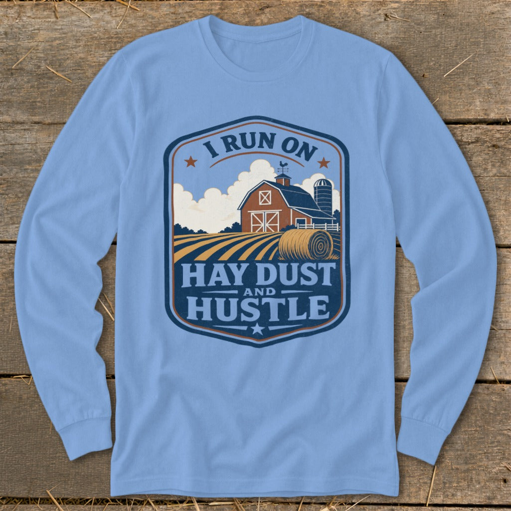 Light blue long-sleeve shirt with "I RUN ON HAY DUST AND HUSTLE" graphic.