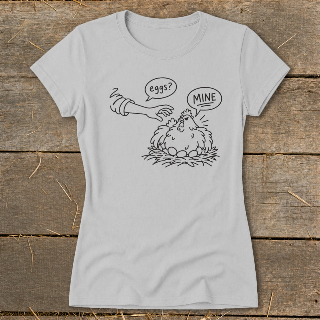 Line art of a chicken protecting its eggs with "MINE" speech bubble, next to a hand with "eggs?" bubble.