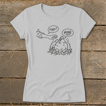 Line art of a chicken protecting its eggs with "MINE" speech bubble, next to a hand with "eggs?" bubble.