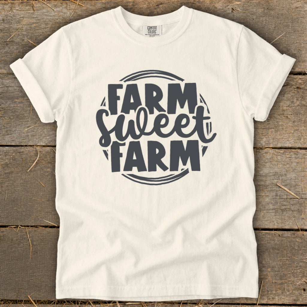 Cream t-shirt with "Farm Sweet Farm" text in dark grey graphic.