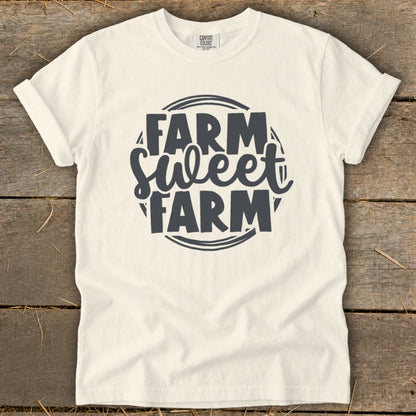Cream t-shirt with "Farm Sweet Farm" text in dark grey graphic.