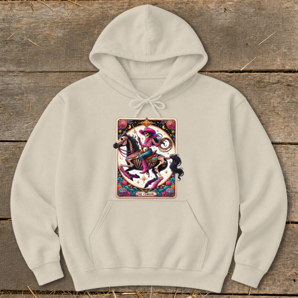 Light tan hoodie featuring a skeleton cowgirl on horseback with text "THE COWGIRL".