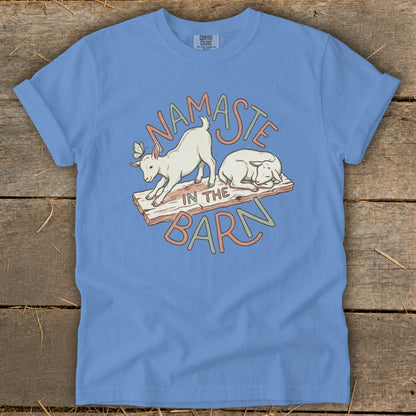 Blue t-shirt with goats and text "Namaste in the Barn".