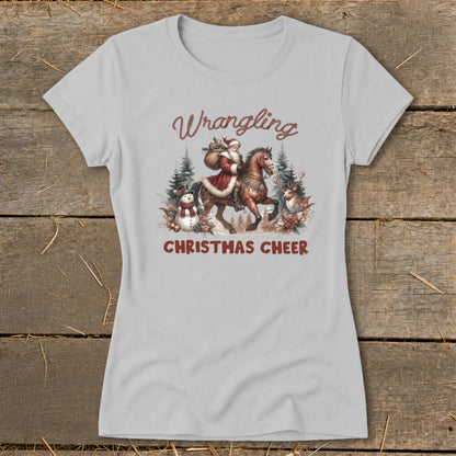 Light grey t-shirt with Santa on horseback and text "Wrangling Christmas Cheer".