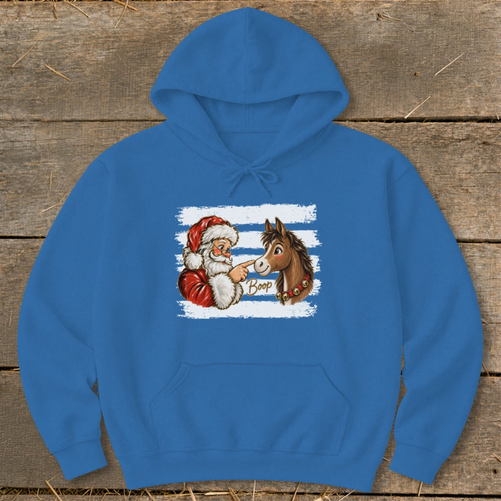 Santa booping a donkey with the word "Boop" printed on the donkey.