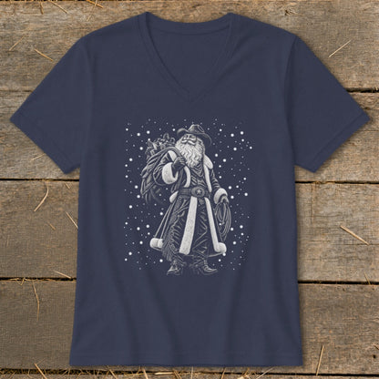 Santa Claus wearing a cowboy hat and holding a lasso and sack of gifts.
