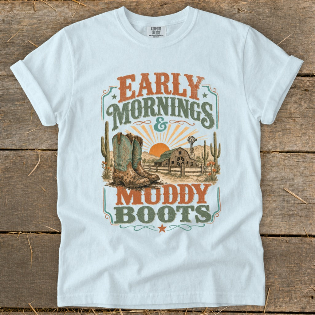 White t-shirt with "EARLY MORNINGS & MUDDY BOOTS" text and western graphic.