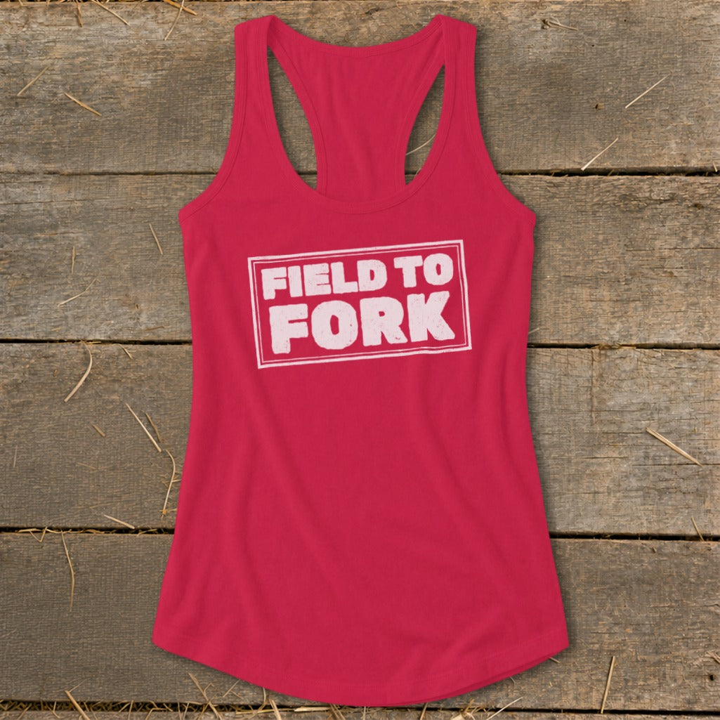 Red racerback tank top with a white bordered box containing the text FIELD TO FORK.