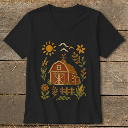 Black t-shirt with a red barn illustration surrounded by farm-themed elements and floral accents.