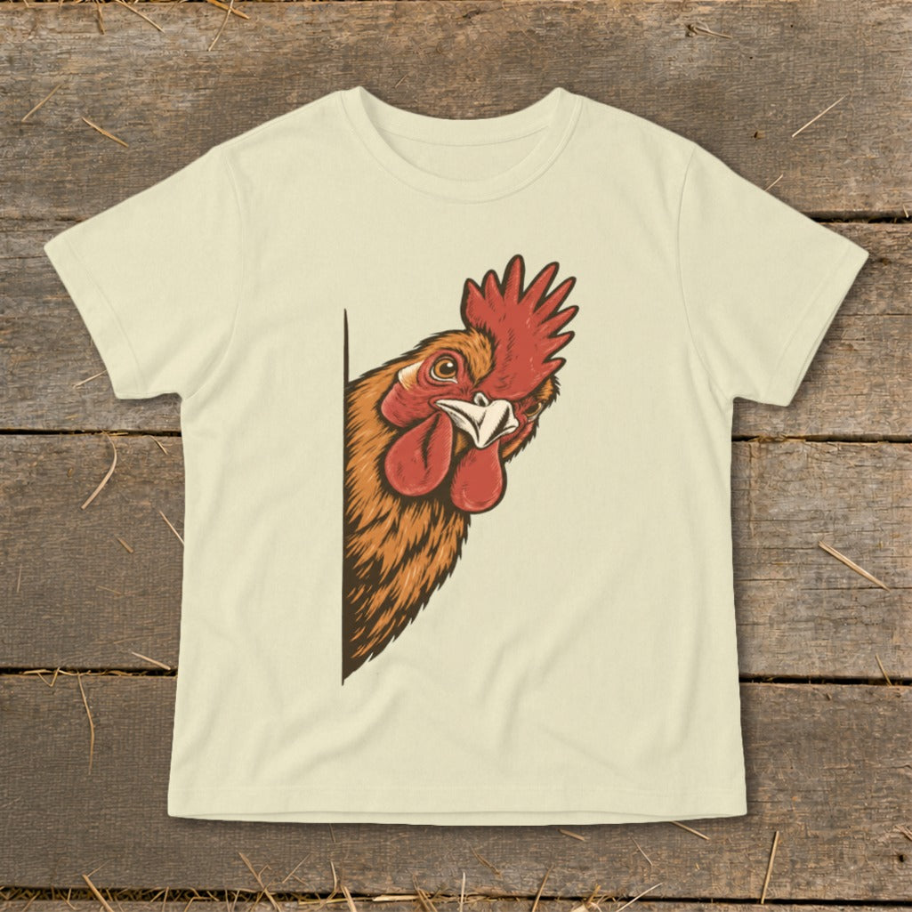 Rooster peeking from behind a corner on a cream t-shirt.
