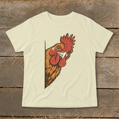 Rooster peeking from behind a corner on a cream t-shirt.