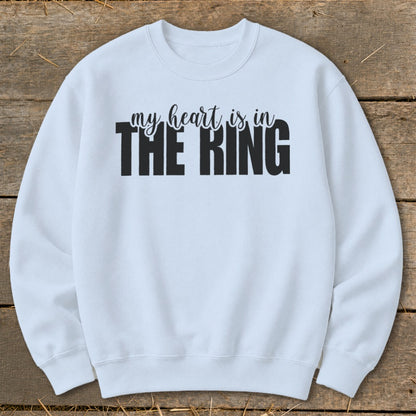 Light blue sweatshirt with black text "my heart is in THE RING".