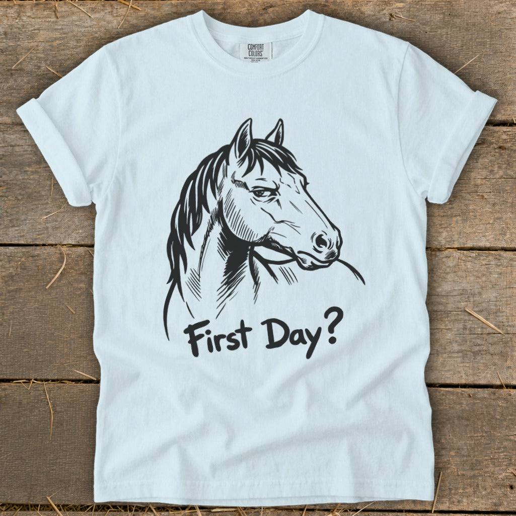 Light blue t-shirt with black sketch of a horse head and text "First Day?".