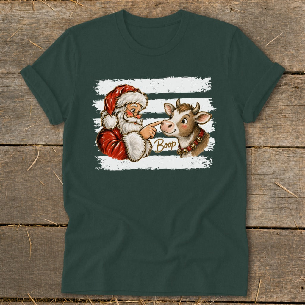 Santa boops a cow with the word "Boop" on a dark green t-shirt.