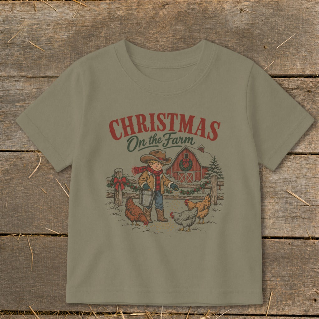 Christmas On the Farm t-shirt with boy feeding chickens near a barn.