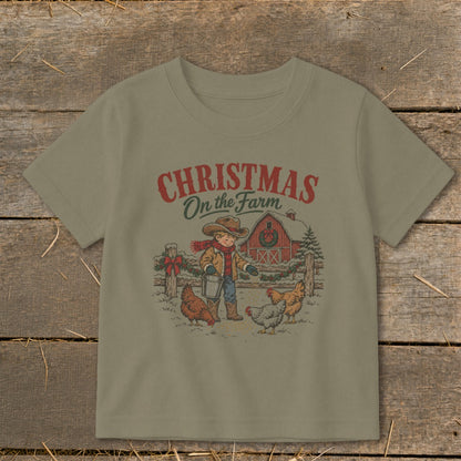 Christmas On the Farm t-shirt with boy feeding chickens near a barn.