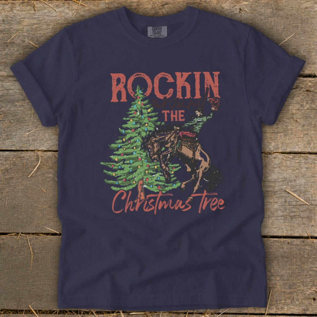 Navy t-shirt with "Rockin the Christmas Tree" graphic featuring a cowboy on a bucking horse.