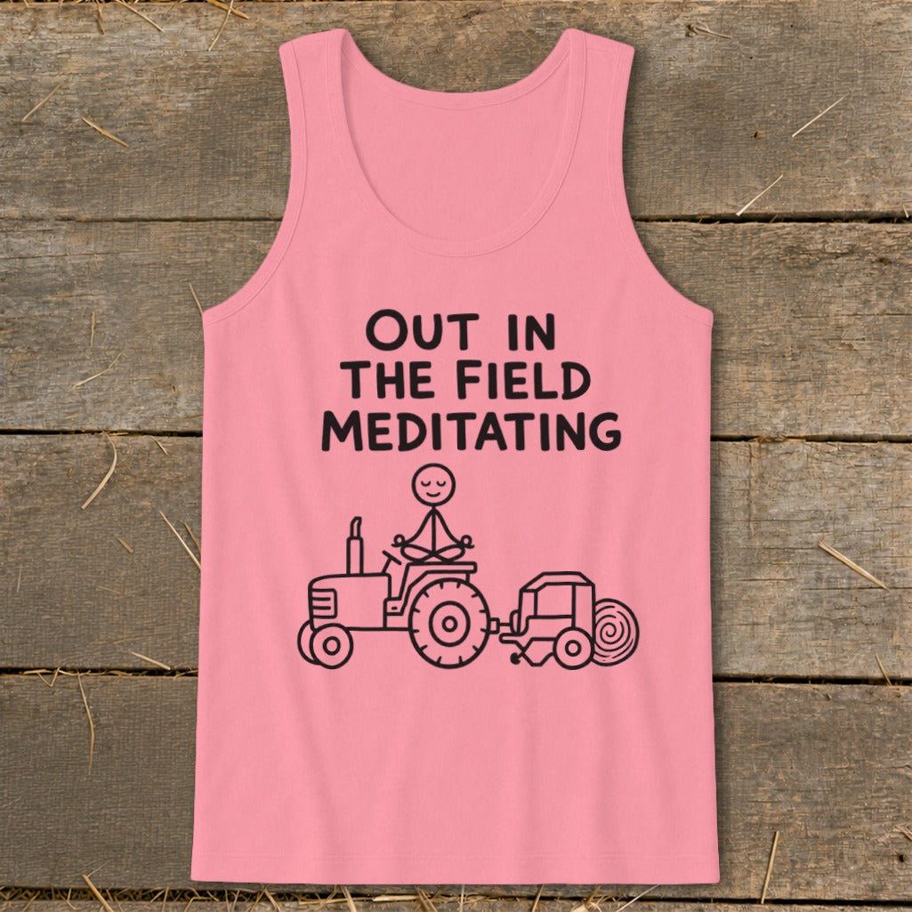 Pink tank top with "Out in the Field Meditating" text and a stick figure meditating on a tractor.