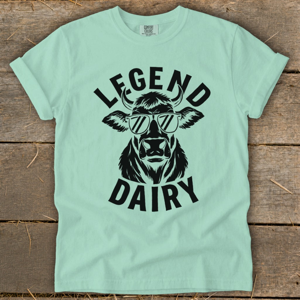 Mint t-shirt with black graphic of a cow wearing sunglasses and text "LEGEND DAIRY".