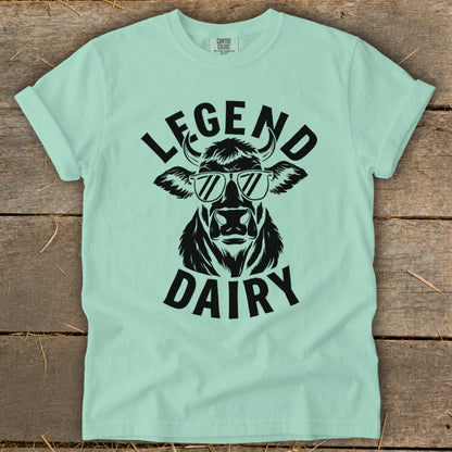 Mint t-shirt with black graphic of a cow wearing sunglasses and text "LEGEND DAIRY".