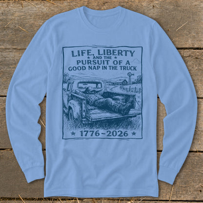 Light blue long sleeve shirt with a graphic of a man napping in a truck.
