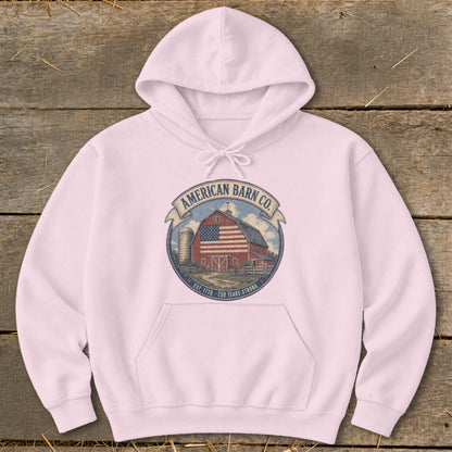 Pink hoodie with American Barn Co. emblem featuring a barn and American flag.