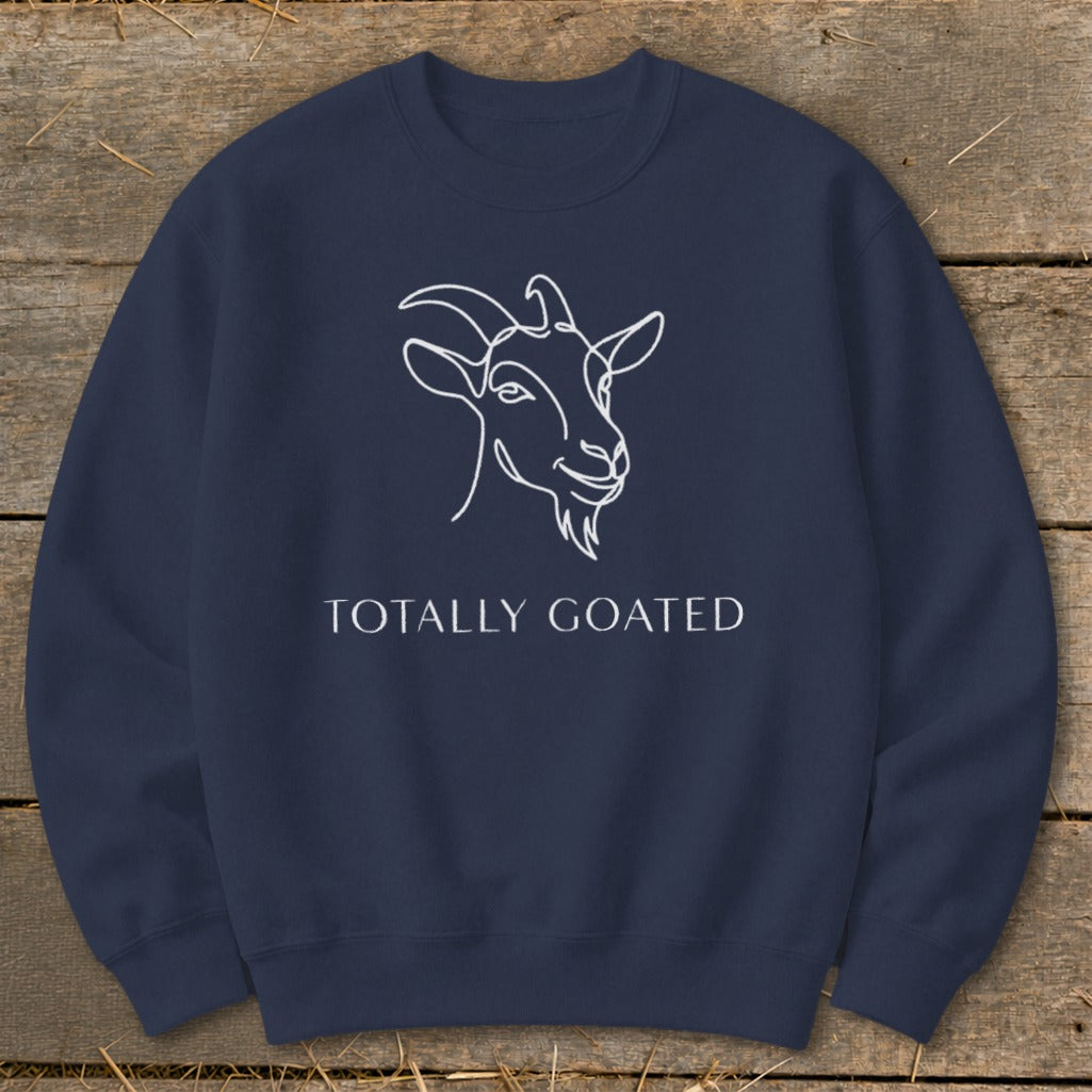 Navy sweatshirt with white line drawing of a goat and "TOTALLY GOATED" text.