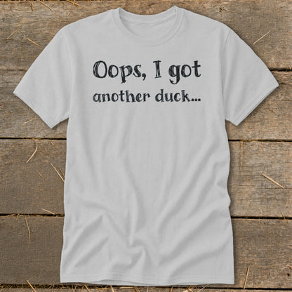 Light grey t-shirt with black text reading "Oops, I got another duck..."