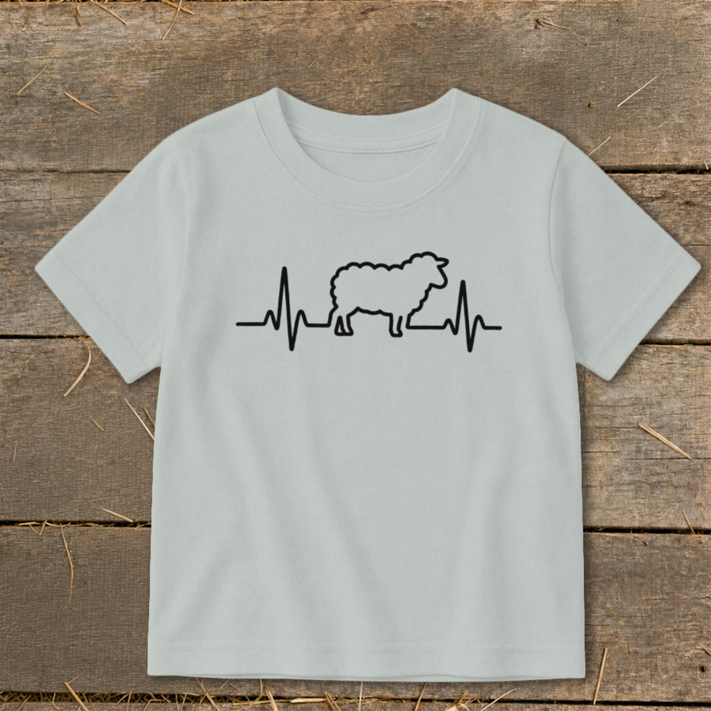 A light gray t-shirt with a black graphic of a sheep integrated into a heartbeat line.