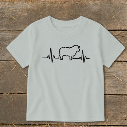 A light gray t-shirt with a black graphic of a sheep integrated into a heartbeat line.
