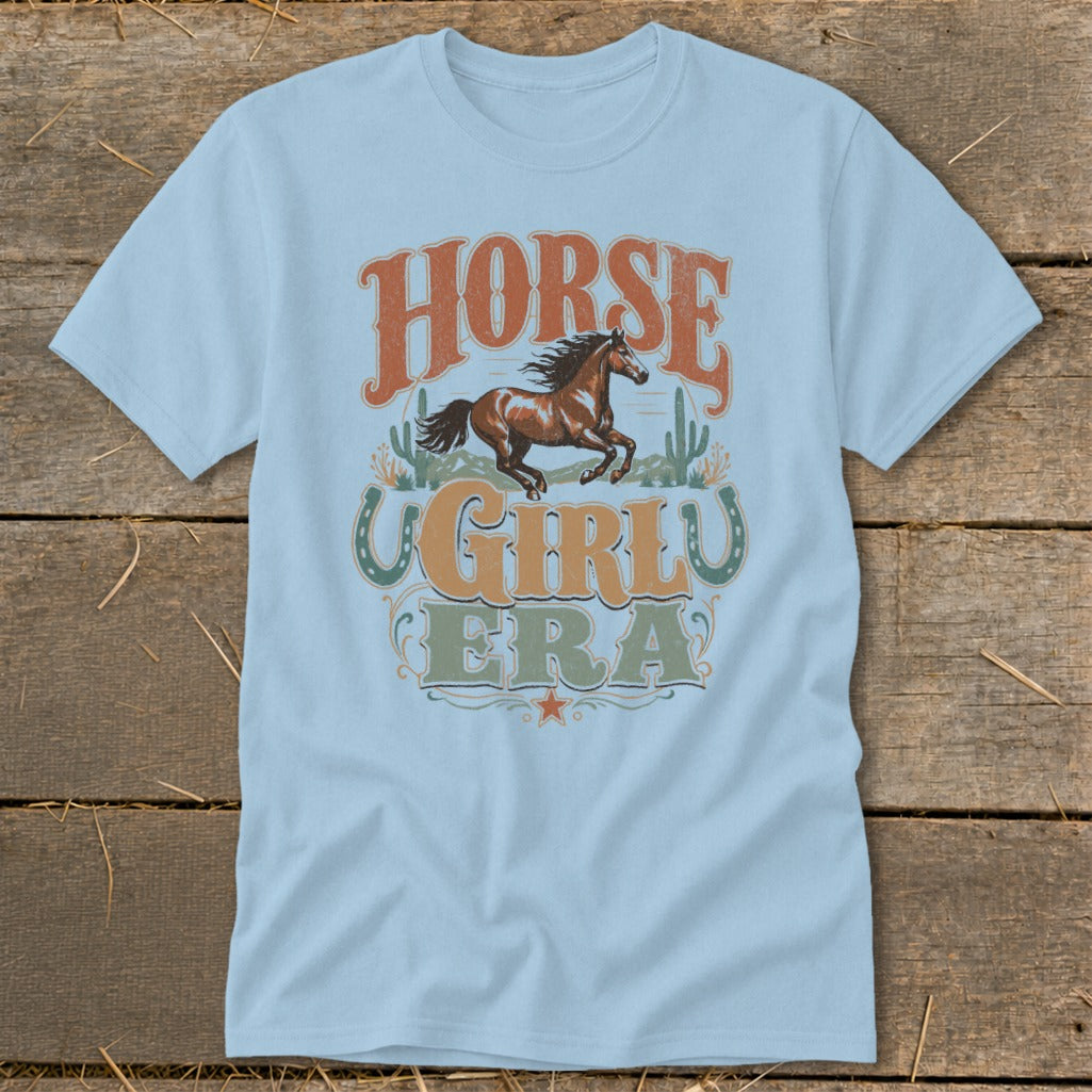 Light blue t-shirt with "HORSE GIRL ERA" text and a running horse graphic.