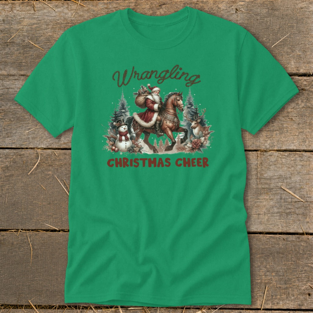 Green t-shirt with Santa on horseback, snowman, and deer, saying "Wrangling Christmas Cheer".
