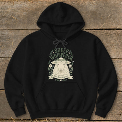 Black hoodie with sheep illustration and text "Sheep Whisperer, it's a love language."