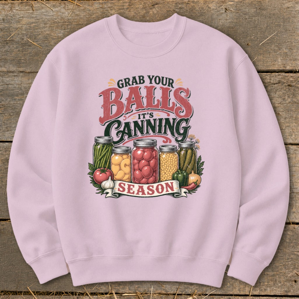 Pink sweatshirt with "Grab your Balls it's Canning Season" text and jars of vegetables.