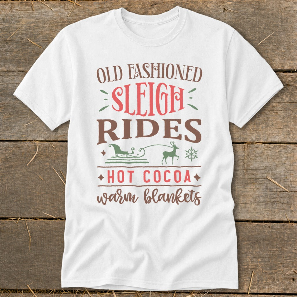 White t-shirt with "Old Fashioned Sleigh Rides Hot Cocoa Warm Blankets" text and graphics.