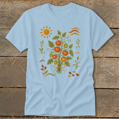 Light blue t-shirt with a stylized tomato plant illustration, sun, and wavy lines.