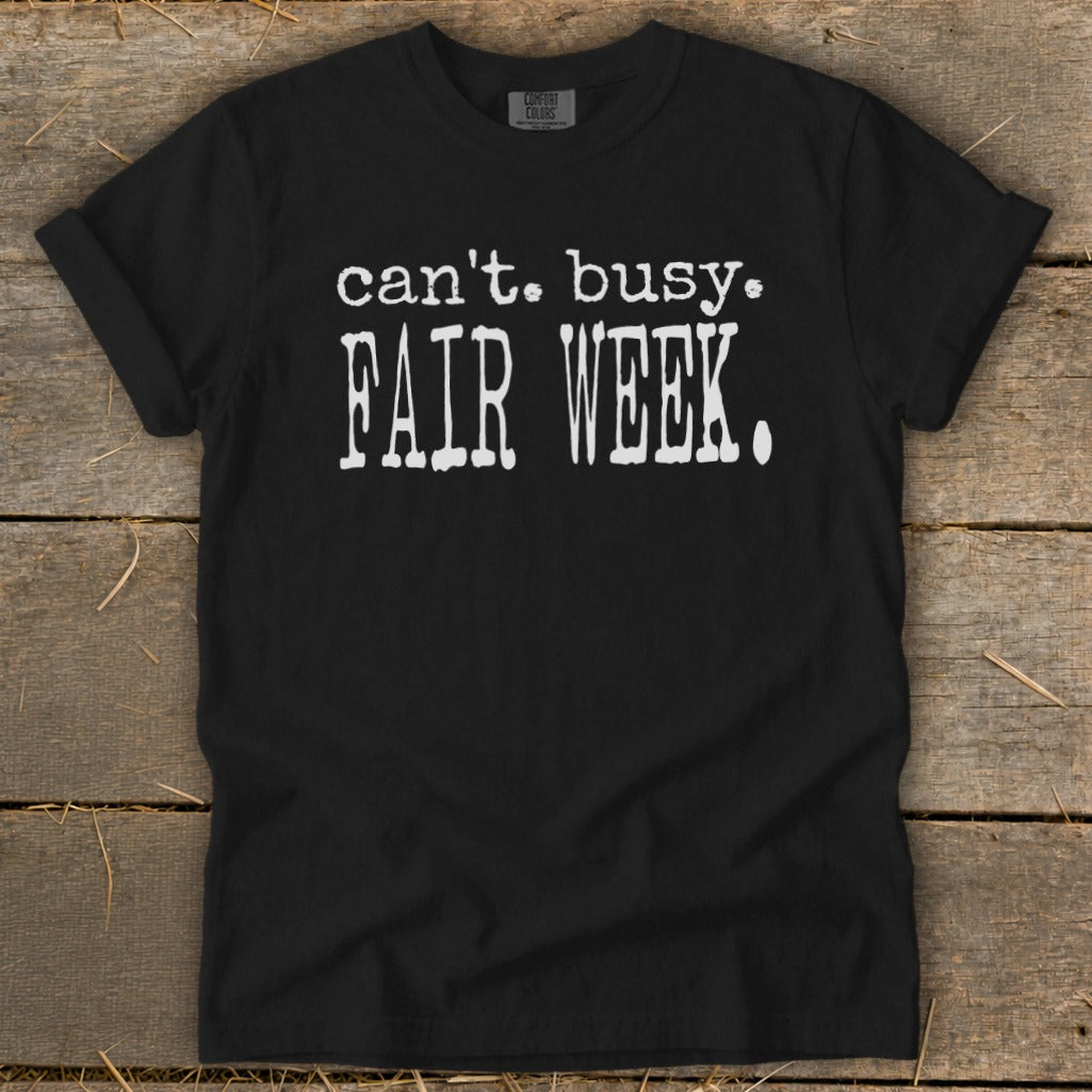 Black t-shirt with white text reading "can't. busy. FAIR WEEK."